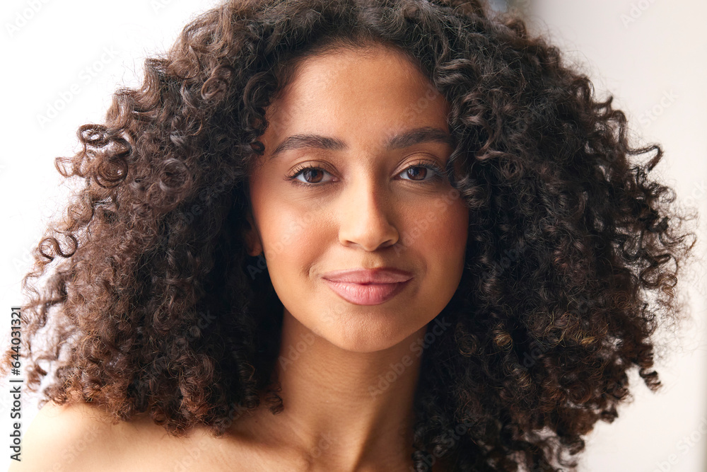Close Up Studio Portrait Of Smiling Natural Woman Standing Against Neutral Background Close Up Studio Portrait Of Smiling Natural Woman Standing Against Neutral Background