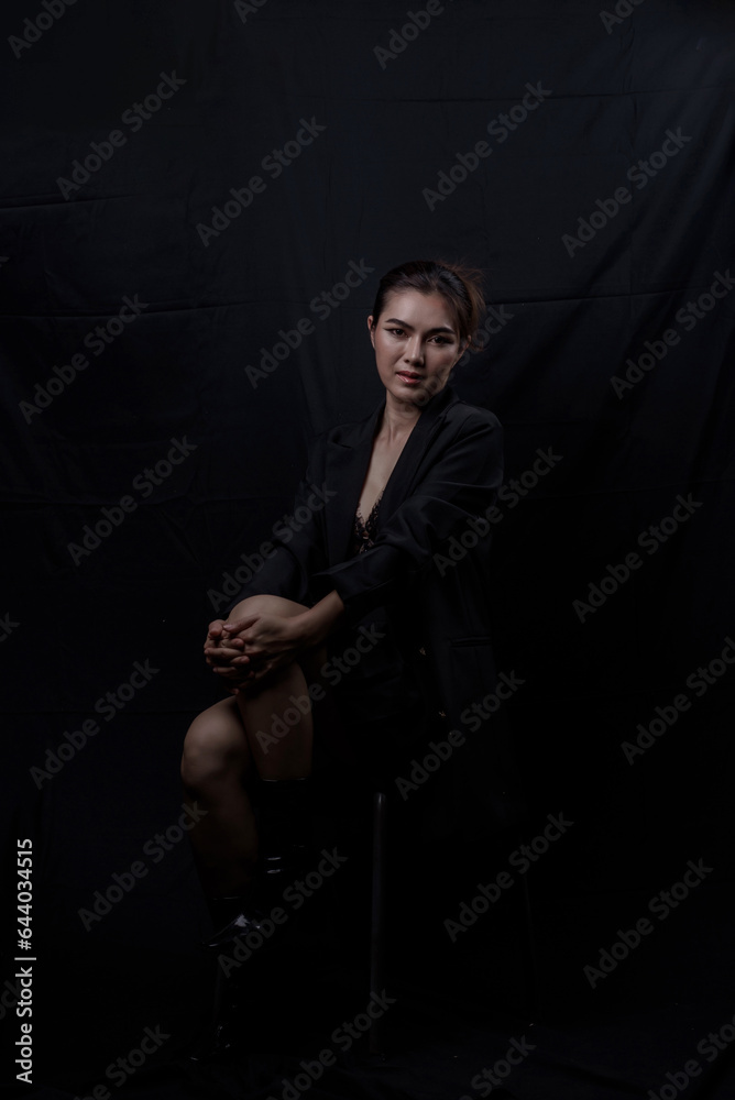 Sexy asian woman n in black lace underwear bra sexually isolated on black background. Sexy asian woman n in black lace underwear bra sexually isolated on black background.