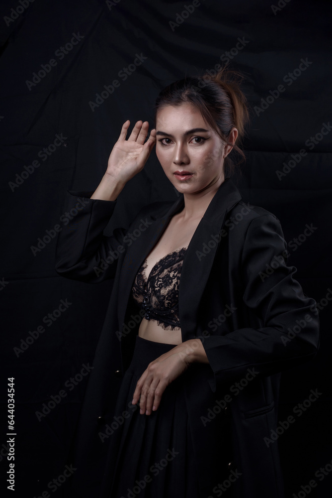 Sexy asian woman n in black lace underwear bra sexually isolated on black background. Sexy asian woman n in black lace underwear bra sexually isolated on black background.