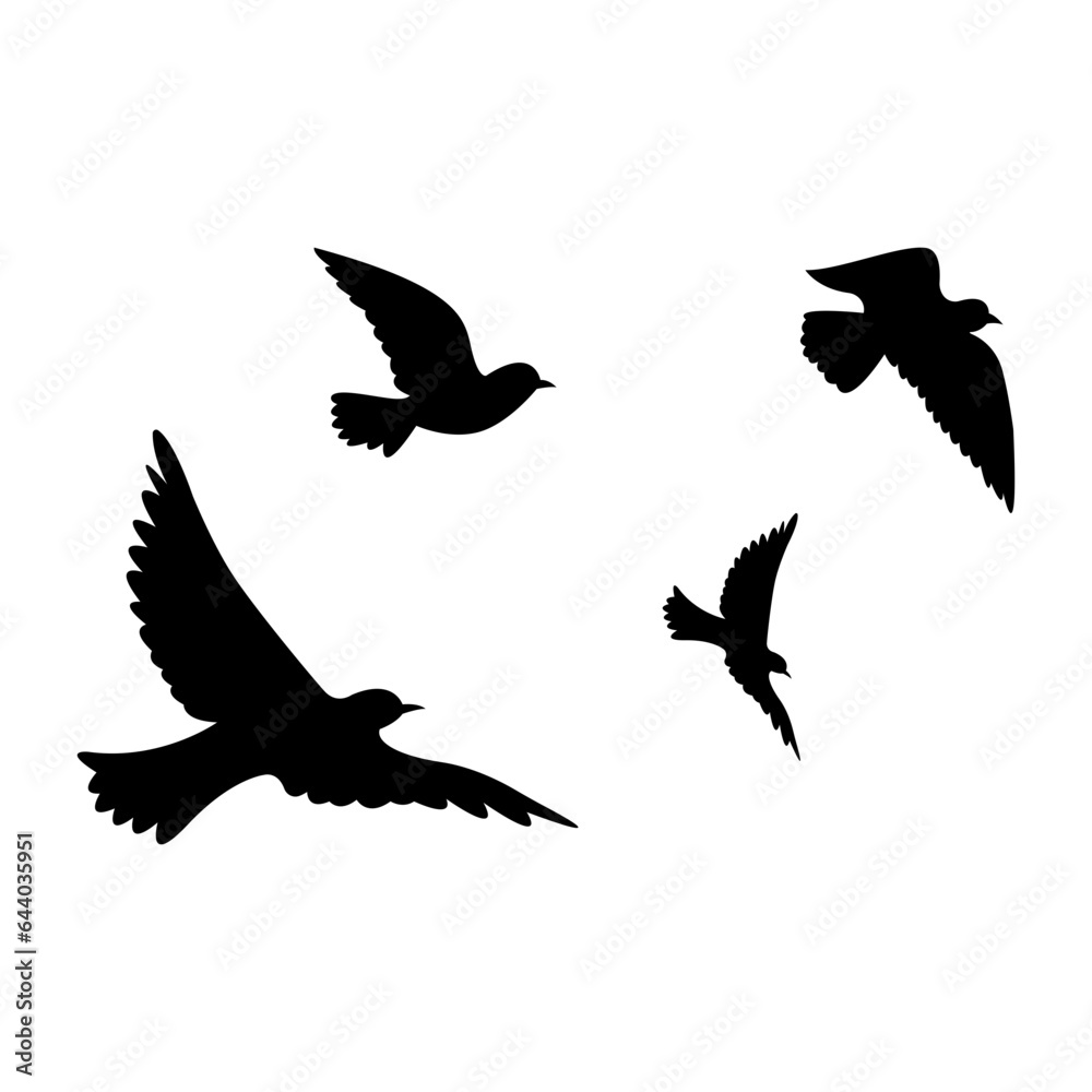 silhouettes of flock birds fly in sky