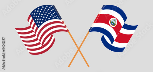 Crossed and waving flags of the USA and Costa Rica