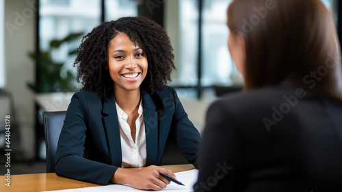 African american woman consulting with financial manager in the office, bank and finance concept for investment or job interview for management
