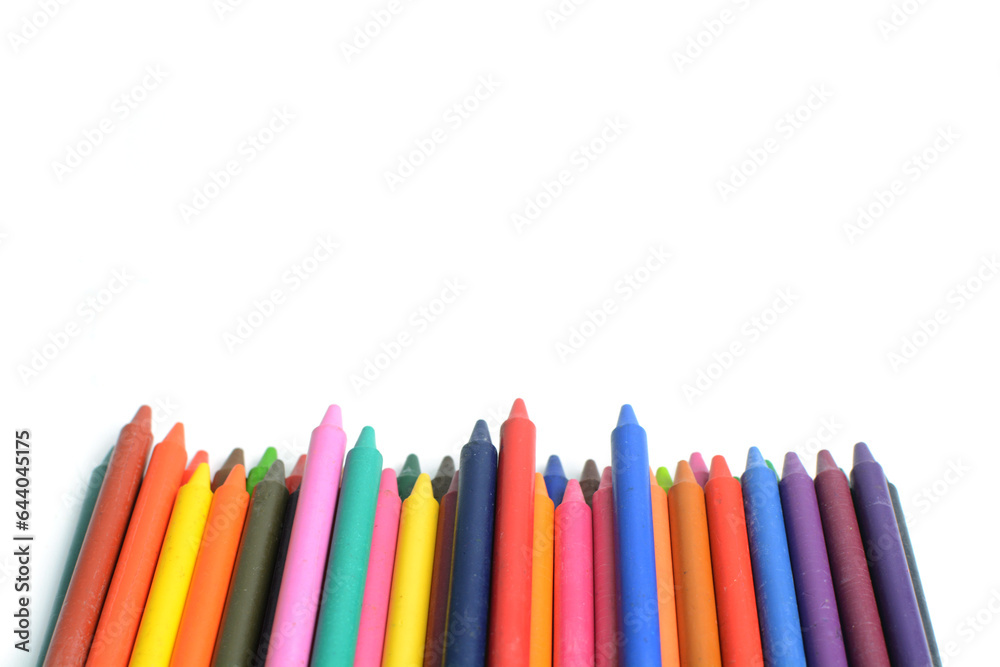 Crayons lined up isolated on white background. Crayons lined up isolated on white background.
