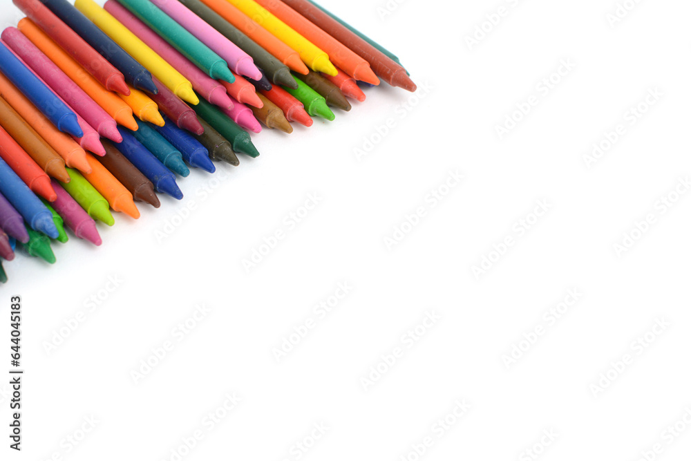 Crayons lined up isolated on white background.