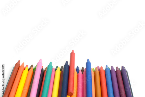 Crayons lined up isolated on white background.