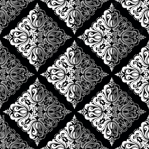Wallpaper in the style of Baroque. Seamless vector background. White and black floral ornament. Graphic pattern for fabric, wallpaper, packaging. Ornate Damask flower ornament
