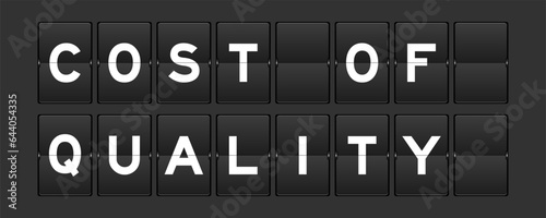 Black color analog flip board with word cost of quality on gray background