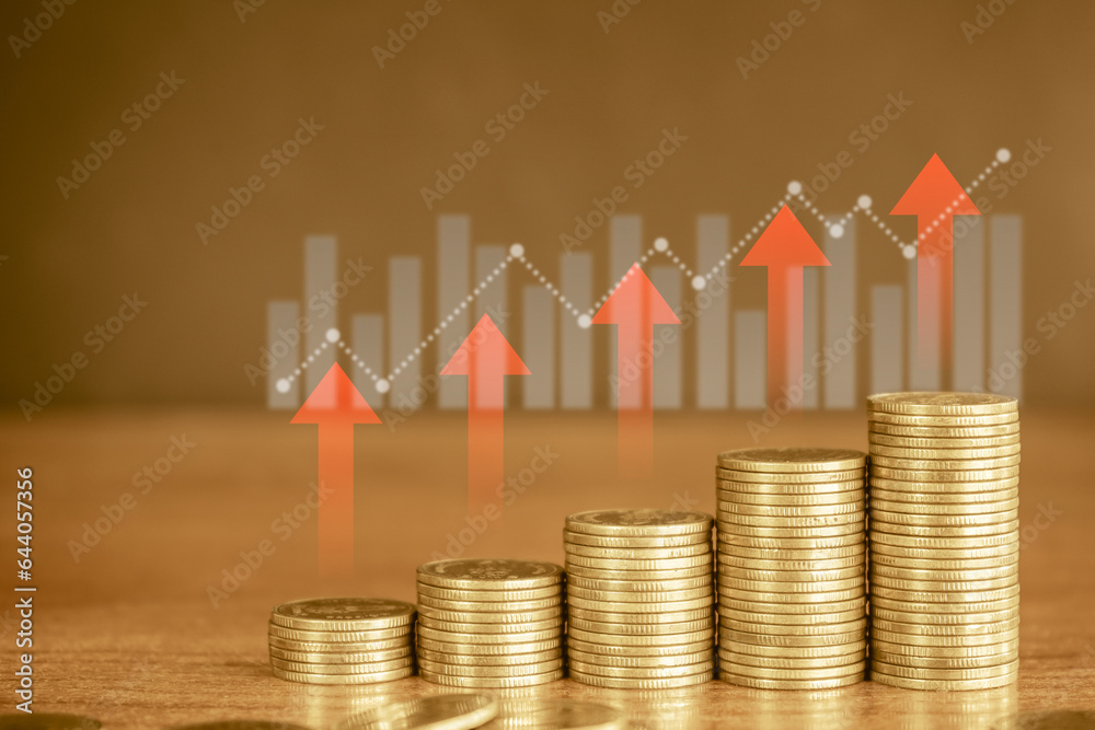 up stack of golden money coin with graph and red up arrow. Business and financial background concept. up stack of golden money coin with graph and red up arrow. Business and financial background concept.