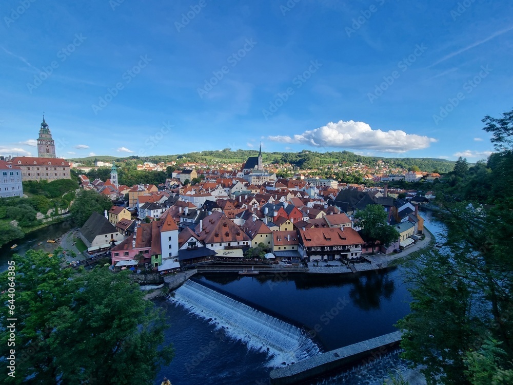 View of historical centre of Cesky Krumlov town on Vltava riverbank on autumn day overlooking medieval Castle, Czech Republic. View of old town of Cesky Krumlov, South Bohemia, Czech Republic.
