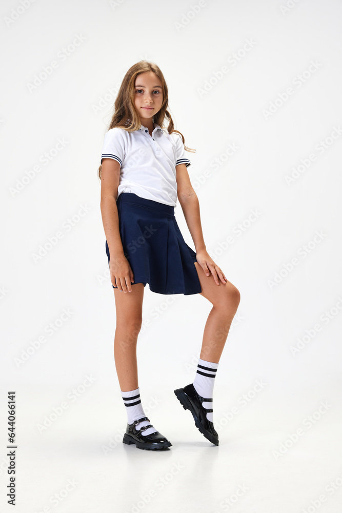 Full-length portrait of beautiful school girl, child in stylish uniform ...