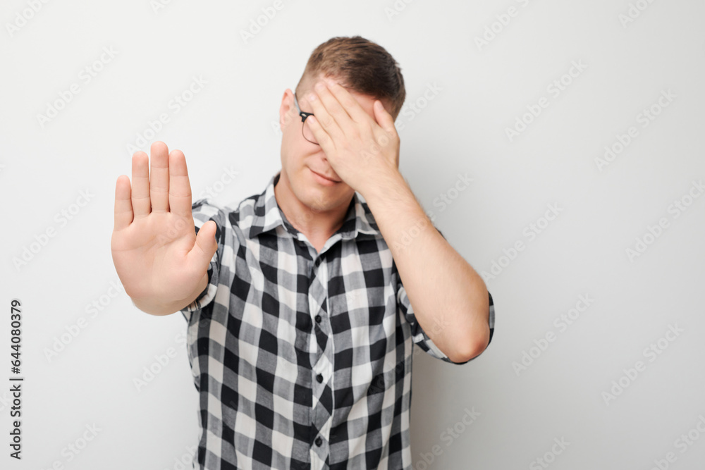 Frustrated Human Portrait of frustrated man with face palm making stop gesture with hand ...
