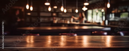 Empty wooden table in cozy pub. Bar vibes. Vintage counter in soft bokeh. Cafe ambiance. Abstract tabletop with bokeh lights © Bussakon