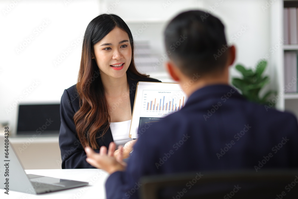 Boss and secretary working on documents together in office. Businessman and colleagues discussing in office collaboration. Boss and secretary working on documents together in office. Businessman and colleagues discussing in office collaboration.