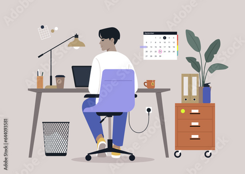 A young character diligently using their computer at a desk, viewed from behind