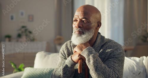 Home, thinking and old man with depression, memory and remember with retirement, alone and sad. Male person, elderly guy or pensioner in a living room, depressed and mental health issue with thoughts photo