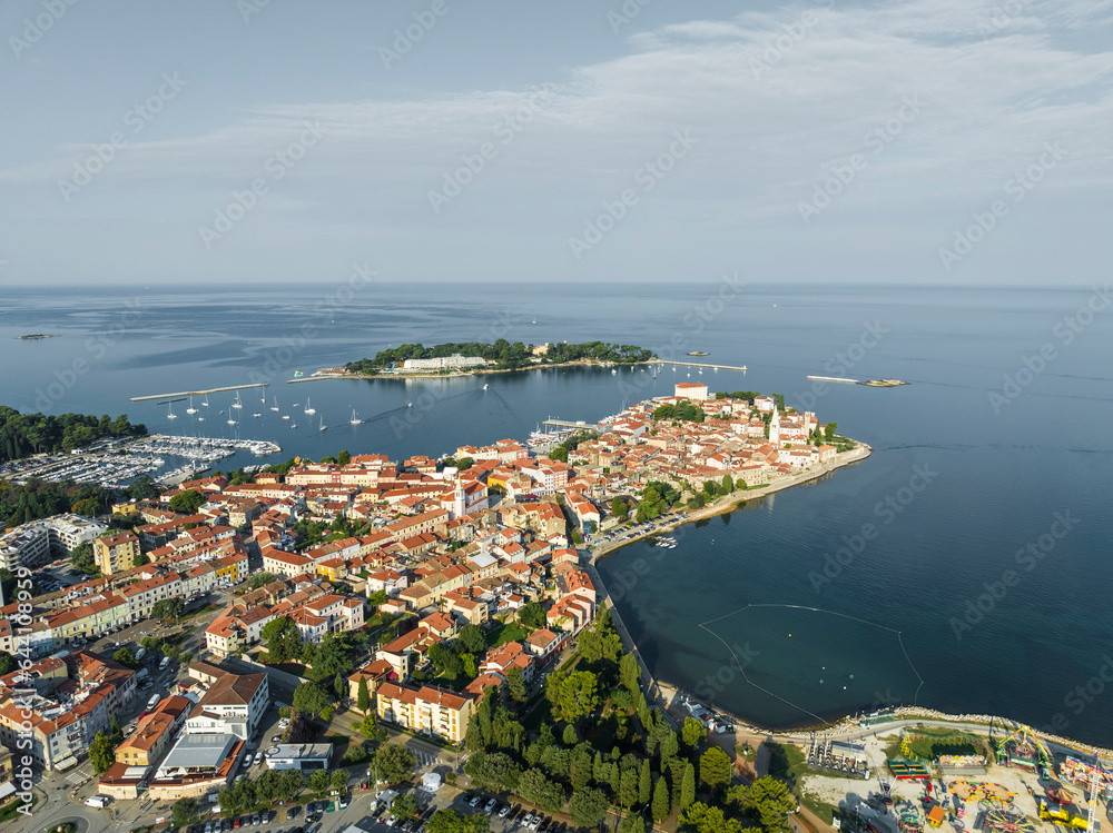 Aerial view of Porec at sunrise, a small town along the Adriatic Sea coastline in Istria, Croatia. Aerial view of Porec at sunrise, a small town along the Adriatic Sea coastline in Istria, Croatia.