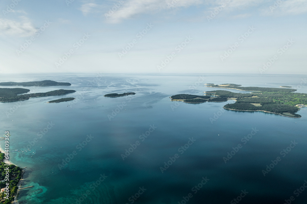 Aerial view of Brijuni National Park, a group of islands along the Adriatic Sea coastline at sunset near Pula, Istria, Croatia. Aerial view of Brijuni National Park, a group of islands along the Adriatic Sea coastline at sunset near Pula, Istria, Croatia.