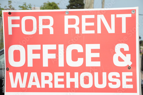 Fotografie for rent office and warehouse writing caption text big large sign in white capit