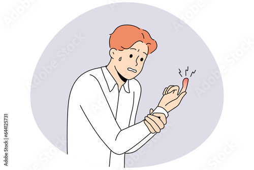 Unhappy man suffer from finger trauma. Unwell guy look at red bruised hand. Hand damage concept. Vector illustration.