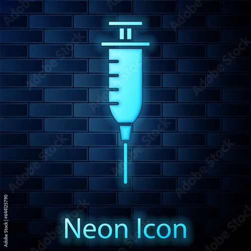 Glowing neon Syringe icon isolated on brick wall background. Syringe for vaccine, vaccination, injection, flu shot. Medical equipment. Vector Illustration