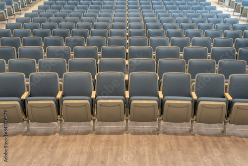 Empty gray and blue theater, auditorium seats, chairs. 