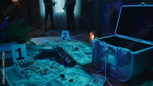 Table with evidence numbers and illegal criminal objects in the dark room. Crime scene creative concept.