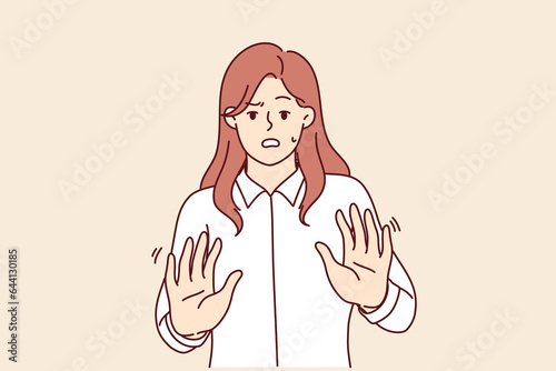 Frightened businesswoman makes stop gesture and experiences panic attack due to news of economic crisis. Unhappy panicked entrepreneur girl needs psychological help due to stress and overwork
