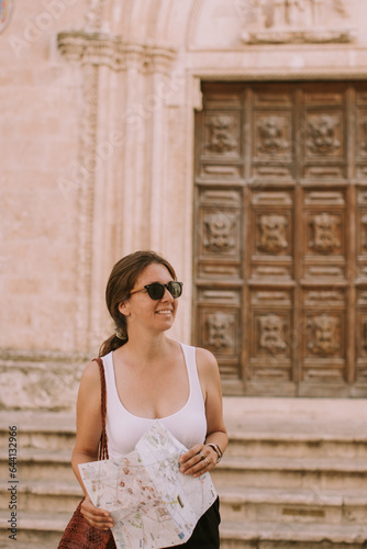 Female tourist with city ma...