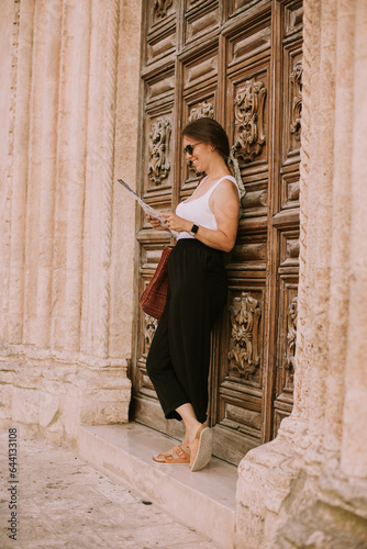 Female tourist with city ma...
