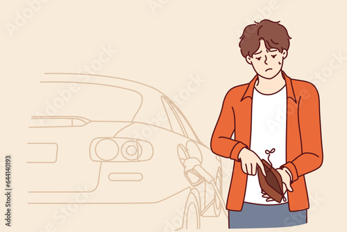 Lack of money for fuel for car for man with empty wallet, due to inflation and rising prices or energy crisis. Upset guy cant pay for donated fuel for vehicle and needs benefits from state