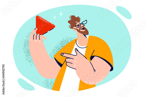 Man with smile points to red triangle symbolizing ban on further movement and call to stop