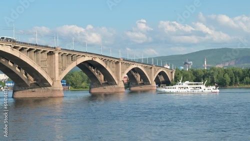 View of Communal bridge in Krasnoyarsk. Famous Automobile and pedestrian bridge in Krasnoyarsk, Siberia, Russia.