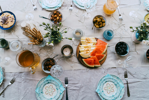 Directly above shot of fresh fruits and drinks arranged on table