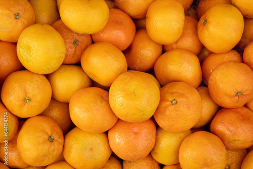 Ripe orange tangerines. Top view of a farmer s market tray