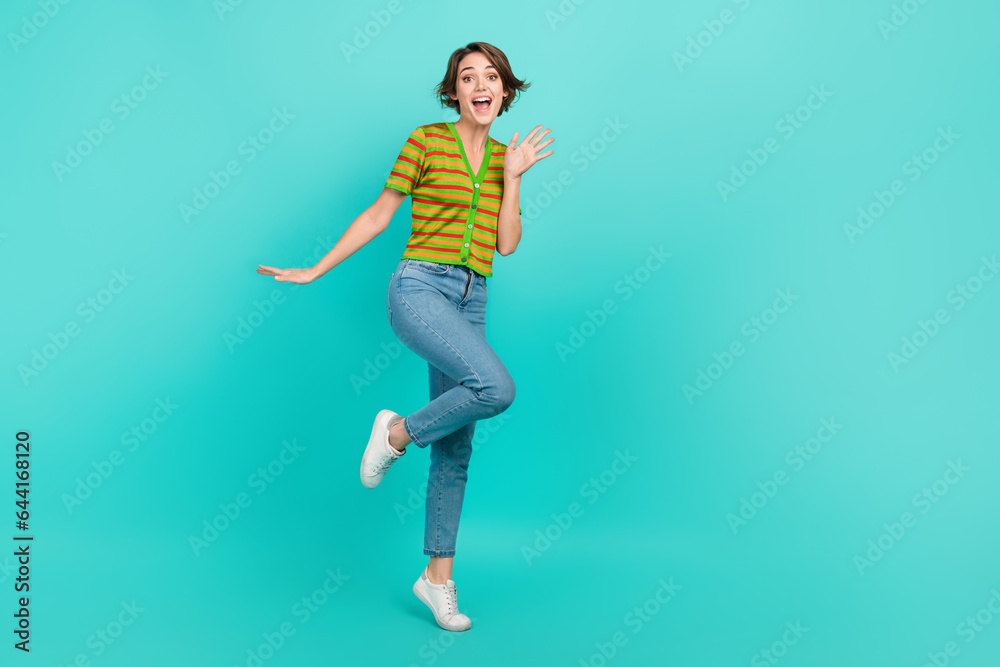 Full length portrait of overjoyed astonished person empty space ad isolated on turquoise color background