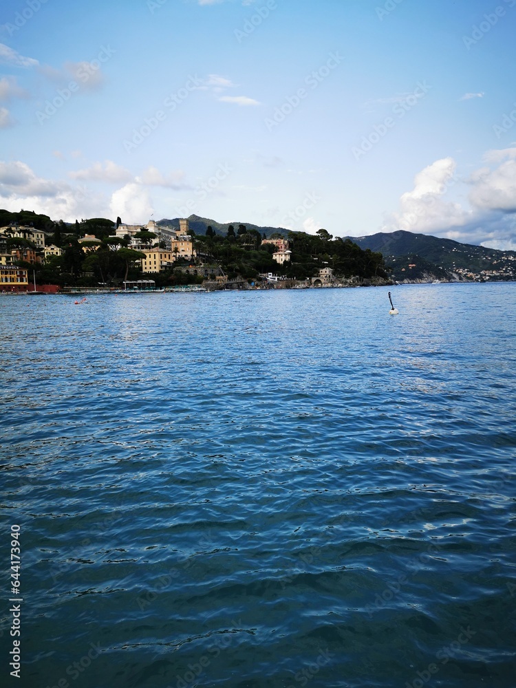 Fototapeta premium Photo of a picturesque waterfront village with houses nestled on a hill