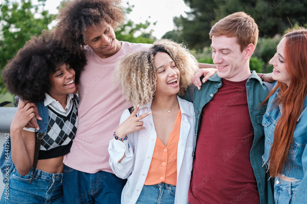Group of students in the outdoor campus relaxed and having fun. Concept: lifestyle, education, studies Group of students in the outdoor campus relaxed and having fun. Concept: lifestyle, education, studies