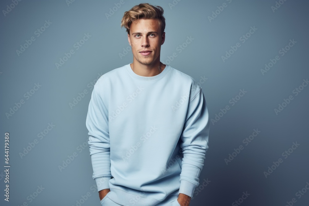 Portrait of a Fictional Model Wearing a Large Oversized Plain Sweatshirt Isolated on a Colored Blank Background. Generative AI. Portrait of a Fictional Model Wearing a Large Oversized Plain Sweatshirt Isolated on a Colored Blank Background. Generative AI.