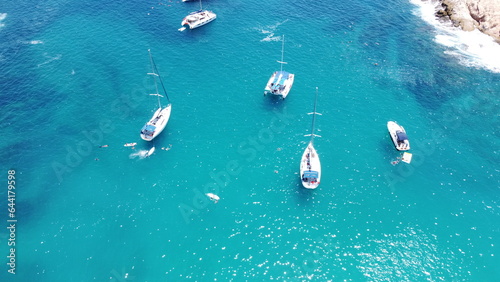 photography with drone of yachts in santa maria beach cabo san lucas california mexico