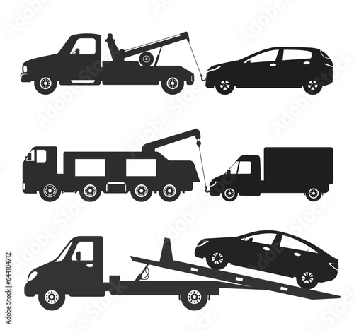 Black silhouette of tow truck towing car trucking vehicle transportation towage 