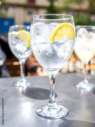 A Gin Tonic cocktail on a table of a bar terrace.