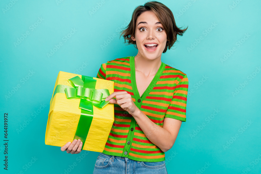Portrait of overjoyed funky person hold open untie ribbon giftbox isolated on turquoise background Portrait of overjoyed funky person hold open untie ribbon giftbox isolated on turquoise background