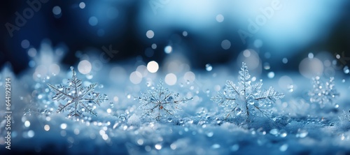 Abstract winter background with big snowflakes on snow on dark background