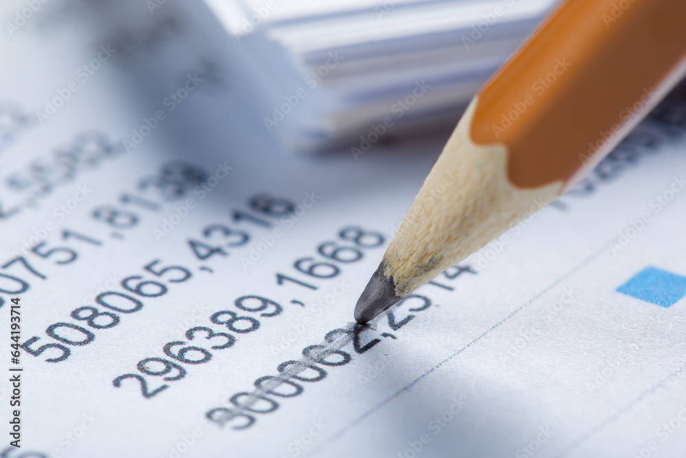 Accounting document with pencil and checking financial chart. Concept of banking, financial report and financial audit. Accounting document with pencil and checking financial chart. Concept of banking, financial report and financial audit.