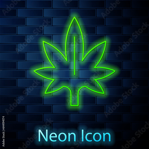 Glowing neon line Medical marijuana or cannabis leaf icon isolated on brick wall background. Hemp symbol. Vector