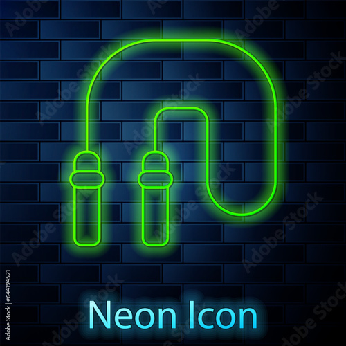 Glowing neon line Jump rope icon isolated on brick wall background. Skipping rope. Sport equipment. Vector