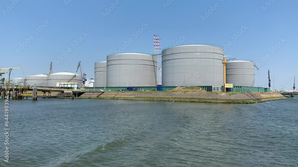 Terminal, industrial storage facility at Port, harbour of Rotterdam. Oil, petroleum and hazardous chemicals tanks, depot. View from a moving ship. Rotterdam, The Netherlands
Terminal, industrial storage facility at Port, harbour of Rotterdam. Oil, petroleum and hazardous chemicals tanks, depot. View from a moving ship. Rotterdam, The Netherlands