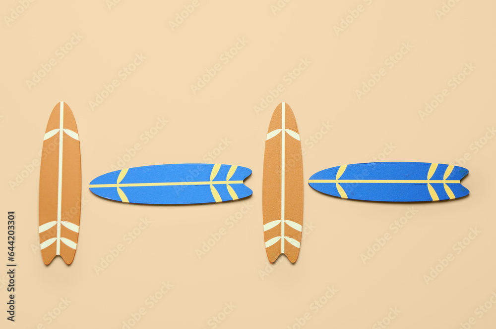 Different mini surfboards on yellow background Different mini surfboards on yellow background