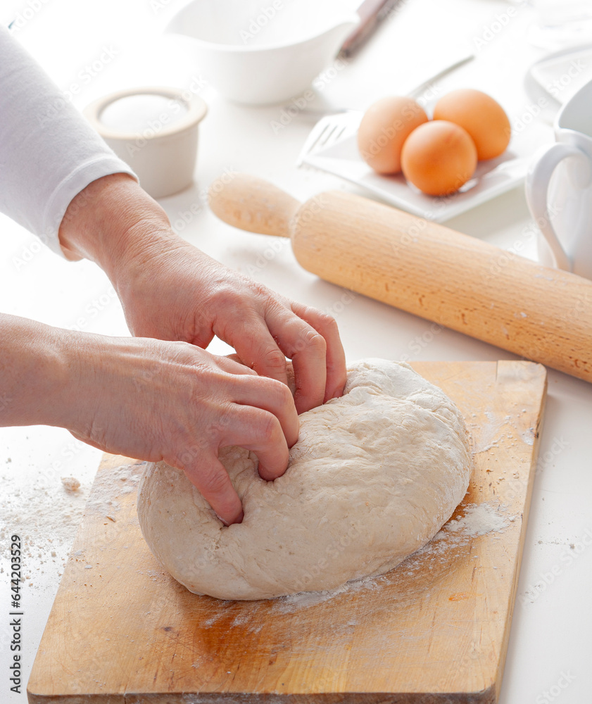 Hands of a person preparing pizza dough Hands of a person preparing pizza dough