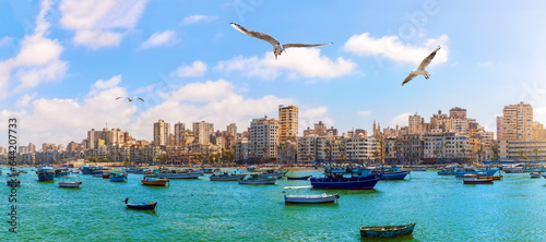 Foto Alexandria harbour with azure waters and boats, beautiful seaside view, Egypt